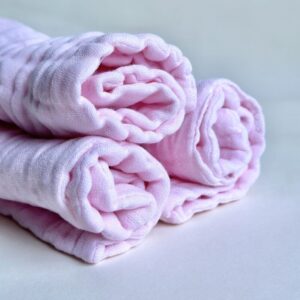 A bunch of Organic Burp Cloths kept together with white background